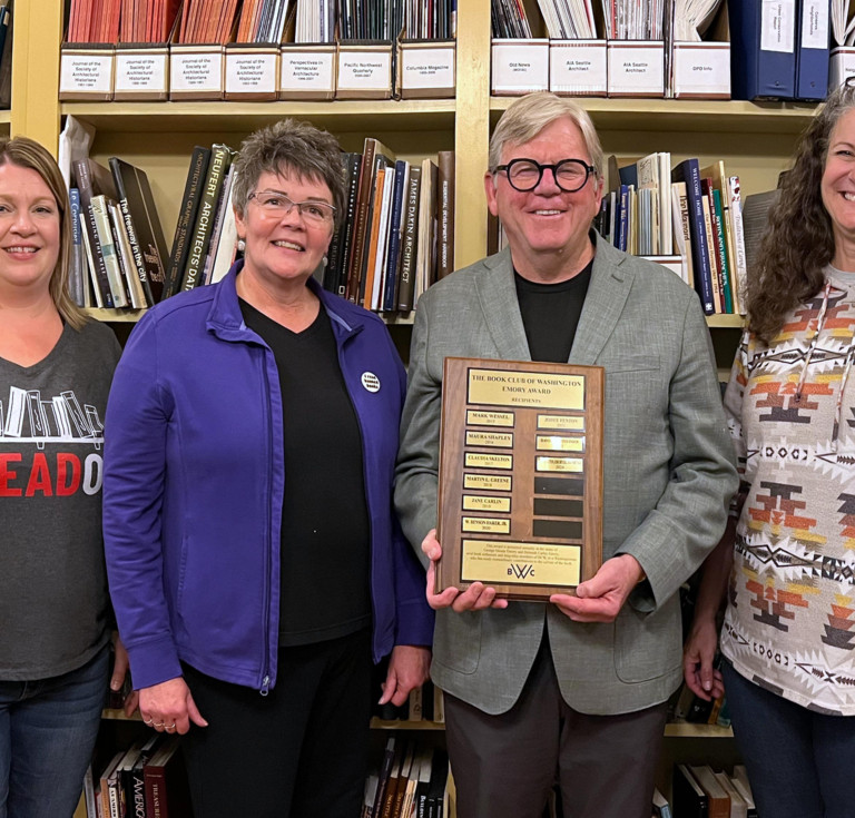 The trio accepting their award